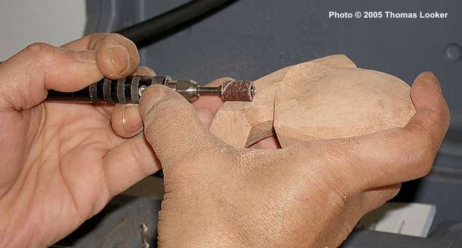 Using the Dremmel on a Cavalier Blowfish in Todd Johnson's workshop.
